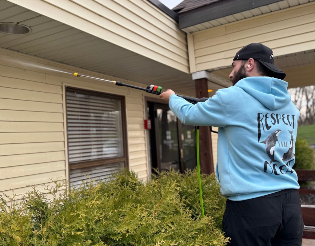 Home exterior showing freshly cleaned gutters glistening under the sun