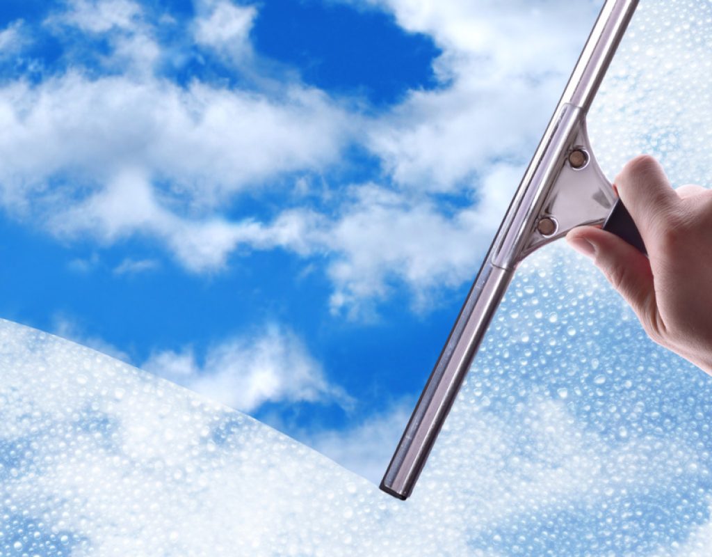 Streak-free windows reflecting sunlight after expert window cleaning service