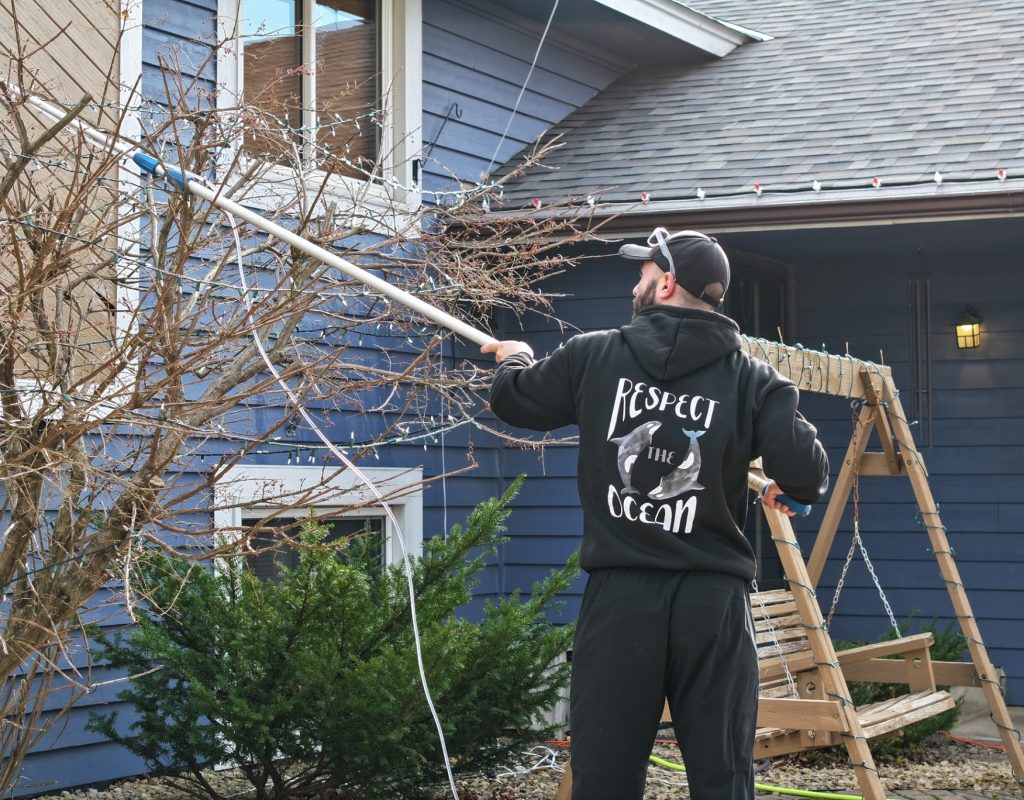 Debris removal during gutter cleaning service in Apple Valley, MN